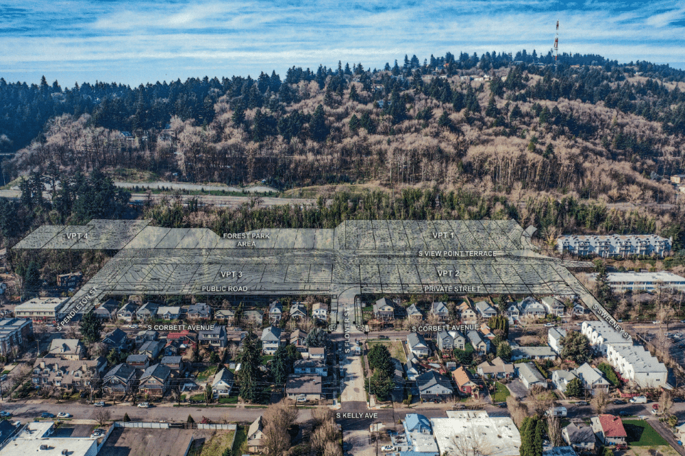 Aerial view of the Viewpoint Luxe development site, with marked sections for the future sustainable living community nestled between the urban edge and Forest Park, offered by Luxe Living Homes.