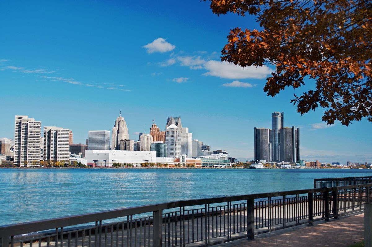 Scenic view of Detroit's waterfront skyline, near the upcoming Detroit Luxe affordable housing community, featuring 62 homes designed for sustainable living by Luxe Living Homes.